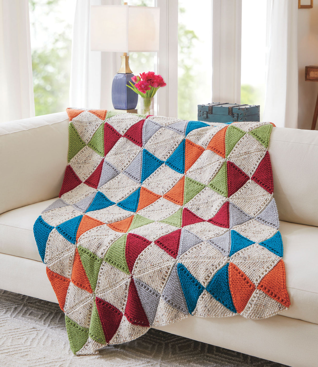 Manta de punto con pajaritas atrevidas