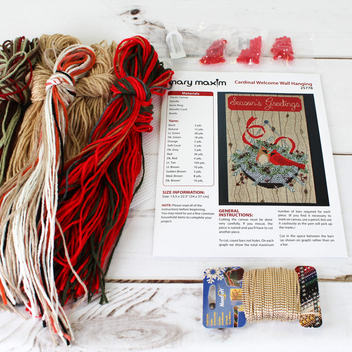 Winter Plastic Canvas Wall Hanging of a Cardinal Nest in a Tree with "Seasons Greetings" against a Red Banner.