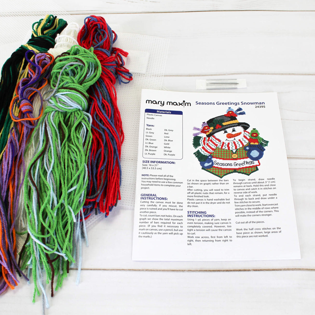 Plastic Canvas Yarn and Needle to make the Seasons Greetings Snowman DIY Wall Hanging