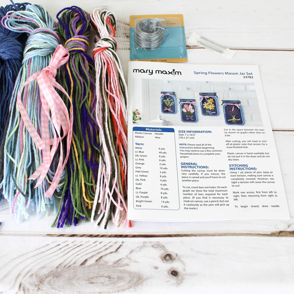 Spring Flowers Plastic Canvas home decor wall hanging 4 mason jars featuring Green, Pink, Yellow, and Purple Flowers on a Blue background.