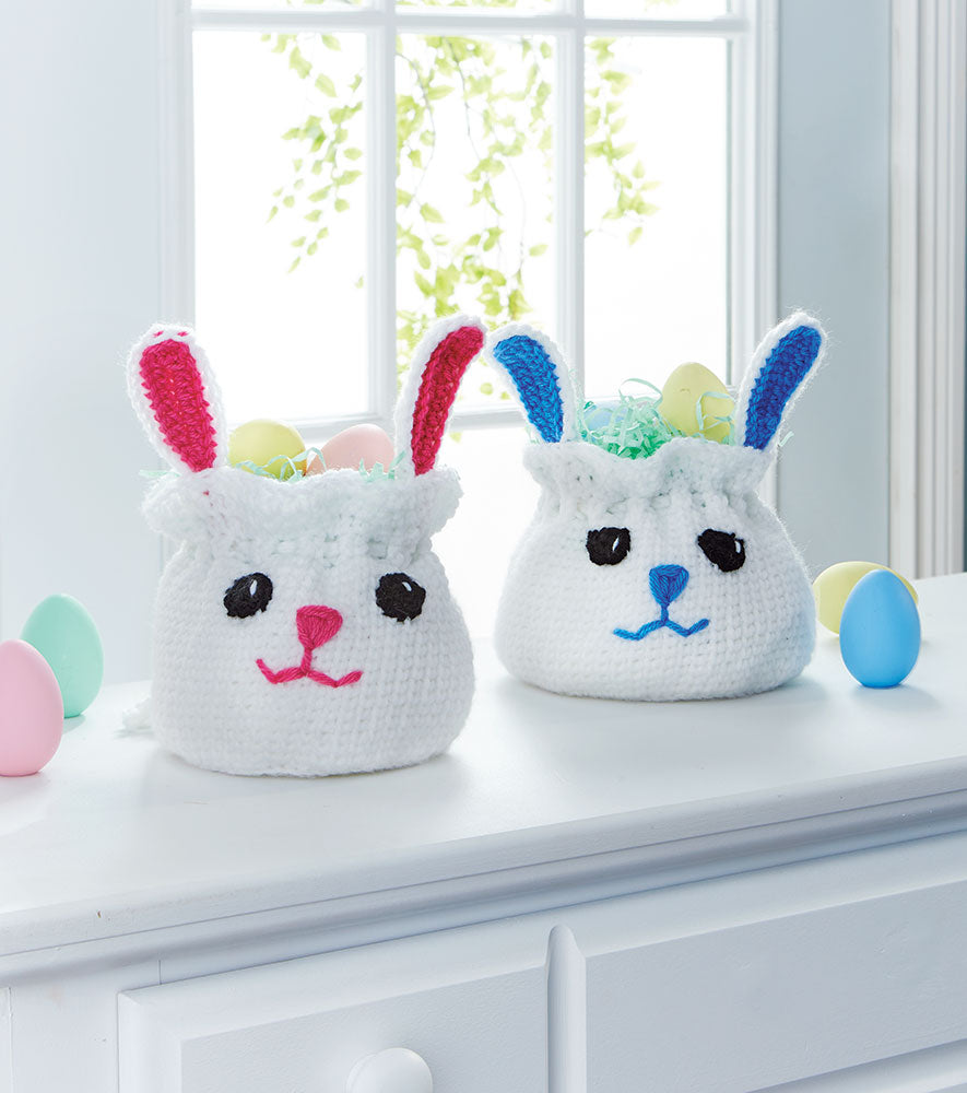 Two Bag Easter Baskets one with Blue Ears and Nose and one with Pink Ears and nose.