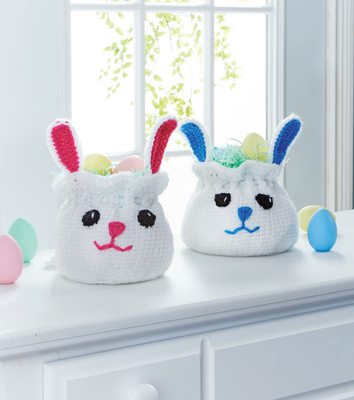 Two Bag Easter Baskets one with Blue Ears and Nose and one with Pink Ears and nose. 