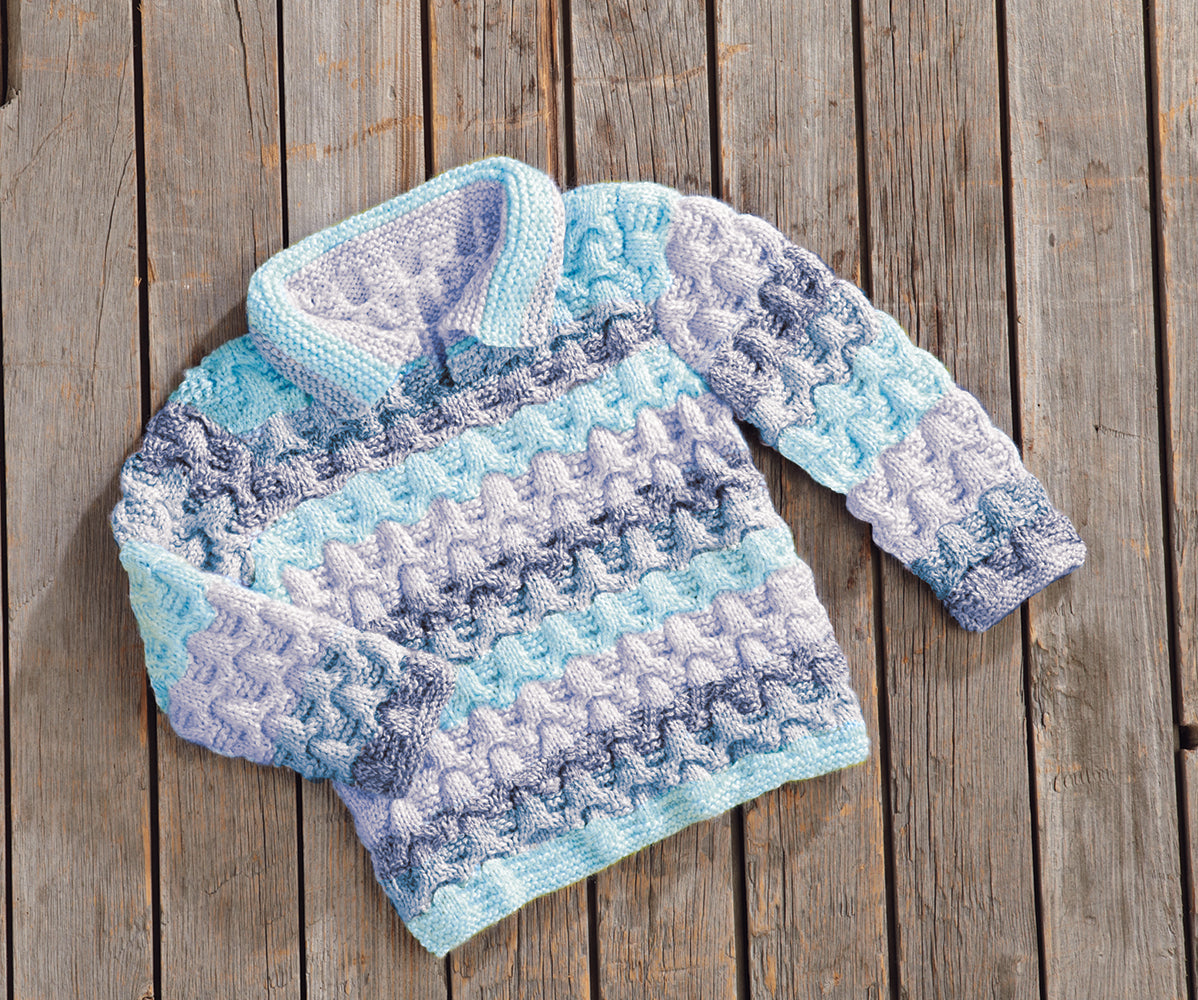 Patrón de jersey con tapeta con cable