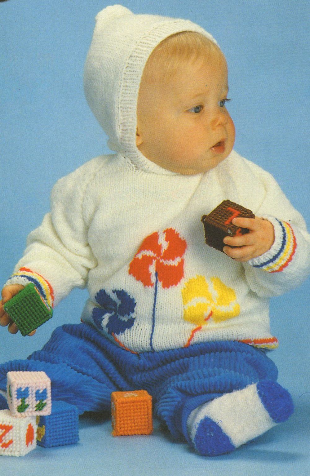 Pull bébé à capuche avec motif moulinets